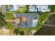 Aerial view of a luxury waterfront home with pool, spa and private boat dock at 2107 4Th Street W Ct, Palmetto, FL 34221