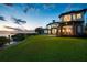 A luxury two-story home with a gorgeous backyard overlooking the water and a private pier at 2107 4Th Street W Ct, Palmetto, FL 34221