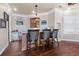 Charming bar area with granite countertops, custom cabinets, and seating for three at 2107 4Th Street W Ct, Palmetto, FL 34221