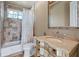 Neutral toned bathroom features tile shower/tub combination and a stylish vanity with a vessel sink at 2107 4Th Street W Ct, Palmetto, FL 34221