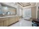 Luxurious bathroom features a standalone tub, decorative lighting, and large countertops with double sinks at 2107 4Th Street W Ct, Palmetto, FL 34221
