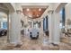 Elegant dining room with columns, travertine floors, and custom lighting at 2107 4Th Street W Ct, Palmetto, FL 34221