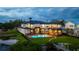 Aerial view of a waterfront estate with a private dock and luxurious pool area at 2107 4Th Street W Ct, Palmetto, FL 34221