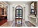 Elegant foyer featuring travertine floors, decorative lighting, and a view into other living spaces at 2107 4Th Street W Ct, Palmetto, FL 34221