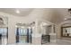 Beautiful foyer with decorative railing, a large bay window, and views of the waterfront at 2107 4Th Street W Ct, Palmetto, FL 34221