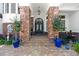 Beautiful front entrance with stone columns, brick steps, and a decorative wrought iron door at 2107 4Th Street W Ct, Palmetto, FL 34221