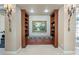 Inviting hallway with built-in bookshelves, a cozy bench, and a decorative painting at 2107 4Th Street W Ct, Palmetto, FL 34221