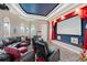 Enjoy movie nights in this dedicated home theater featuring tiered seating and a large projection screen at 2107 4Th Street W Ct, Palmetto, FL 34221
