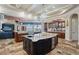 Spacious gourmet kitchen features custom island, granite counters and high-end appliances at 2107 4Th Street W Ct, Palmetto, FL 34221