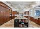 Spacious kitchen featuring a large island, custom cabinetry, and a chandelier at 2107 4Th Street W Ct, Palmetto, FL 34221