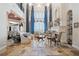 Stunning living room with soaring ceilings, large windows, and stone floors overlooking water at 2107 4Th Street W Ct, Palmetto, FL 34221
