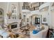 Bright, open living room featuring a fireplace, high ceilings, and wrought iron balcony at 2107 4Th Street W Ct, Palmetto, FL 34221