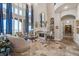 Elegant living room with large windows, fireplace, and neutral tones with blue accents at 2107 4Th Street W Ct, Palmetto, FL 34221