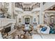 Spacious living room with fireplace, travertine floors and wrought iron balcony at 2107 4Th Street W Ct, Palmetto, FL 34221