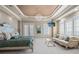 Bright main bedroom features trey ceilings, a chandelier, white carpet, and an attached seating area at 2107 4Th Street W Ct, Palmetto, FL 34221