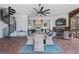 Enjoy outdoor dining under a covered patio with a fireplace, spiral staircase, and a fully-equipped outdoor kitchen at 2107 4Th Street W Ct, Palmetto, FL 34221