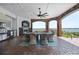 Relaxing outdoor kitchen with brick facade, stone floors, fireplace, stainless grill and panoramic water views at 2107 4Th Street W Ct, Palmetto, FL 34221