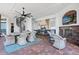 Entertain in style with this covered outdoor kitchen, fireplace and spiral staircase on a brick patio at 2107 4Th Street W Ct, Palmetto, FL 34221