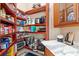 Walk-in pantry with marble countertops and custom wood shelves, perfect for kitchen storage at 2107 4Th Street W Ct, Palmetto, FL 34221