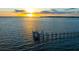 Sunset view from the water showing the horizon line and a pier on the water at 2107 4Th Street W Ct, Palmetto, FL 34221