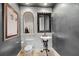 Unique powder room with vintage style fixtures, and a wall-mounted sink, offering a touch of vintage charm at 2107 4Th Street W Ct, Palmetto, FL 34221