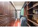 Well-organized walk-in closet features custom shelving and wood floors, providing ample storage space at 2107 4Th Street W Ct, Palmetto, FL 34221