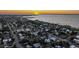 Breathtaking aerial view of a charming coastal community with stunning sunset views over the tranquil ocean at 21480 Eldred Ave, Port Charlotte, FL 33952