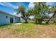 Expansive backyard boasts mature trees providing shade and privacy at 21480 Eldred Ave, Port Charlotte, FL 33952