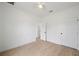 Well-lit bedroom with a ceiling fan, tile floors and access to the ensuite bathroom at 21480 Eldred Ave, Port Charlotte, FL 33952