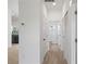 Hallway with wood-look tile flooring providing access to bedrooms and bathroom at 21480 Eldred Ave, Port Charlotte, FL 33952