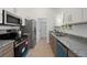 Well-equipped kitchen featuring granite countertops and stainless steel appliances at 21480 Eldred Ave, Port Charlotte, FL 33952