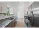 Spacious kitchen with modern appliances and a view of the living area at 21480 Eldred Ave, Port Charlotte, FL 33952