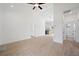 Bright living room featuring wood-look tile flooring and a modern ceiling fan at 21480 Eldred Ave, Port Charlotte, FL 33952