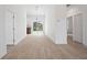 An open-concept living area with wood-look tile floors and lots of natural light at 21480 Eldred Ave, Port Charlotte, FL 33952