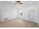 Bright living room featuring wood-look tile floors, fresh white paint and ample natural light at 21480 Eldred Ave, Port Charlotte, FL 33952