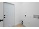 Utility room with hookups and access to the exterior at 21480 Eldred Ave, Port Charlotte, FL 33952