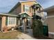 Inviting two-story home featuring green shutters, a matching roof, and a stairway to a private entrance at 224 Boundary Blvd # 224L, Rotonda West, FL 33947