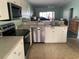 Cozy kitchen featuring modern appliances and an open layout, perfect for entertaining at 224 Boundary Blvd # 224L, Rotonda West, FL 33947