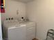 Functional laundry room features a washer and dryer for convenient chores at 224 Boundary Blvd # 224L, Rotonda West, FL 33947