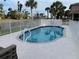 A fenced private pool surrounded by a concrete deck for sunning yourself in the Florida sun at 224 Boundary Blvd # 224L, Rotonda West, FL 33947