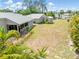 Aerial view of the home showcasing the large yard with the main house and the utility shed at 2411 Atwater Dr, North Port, FL 34288