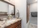 Bathroom with vanity, custom cabinet and granite countertops at 2411 Atwater Dr, North Port, FL 34288