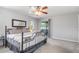 Bright bedroom with sliding doors and a view of the backyard and carpeted floor at 2411 Atwater Dr, North Port, FL 34288