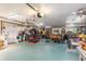 Spacious garage equipped with workbench, storage, and a motorcycle lift, perfect for hobbyists at 2411 Atwater Dr, North Port, FL 34288