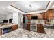 Spacious kitchen features stainless steel appliances, granite countertops, custom cabinets, and recessed lighting at 2411 Atwater Dr, North Port, FL 34288