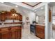 Bright kitchen area flows to a dining area with custom cabinets and a wine rack for entertaining at 2411 Atwater Dr, North Port, FL 34288