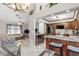 Open concept floor plan with a view of the kitchen with stainless steel appliances and living room at 2411 Atwater Dr, North Port, FL 34288