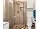 Modern bathroom featuring glass shower with custom tile, white toilet and cabinetry at 25100 Sandhill Blvd # R201, Punta Gorda, FL 33983