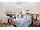 Bedroom featuring wood floors, large window and desk area, perfect for relaxing or working at 25100 Sandhill Blvd # R201, Punta Gorda, FL 33983