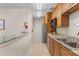Functional kitchenette area with granite countertops and stainless steel appliances at 25100 Sandhill Blvd # R201, Punta Gorda, FL 33983